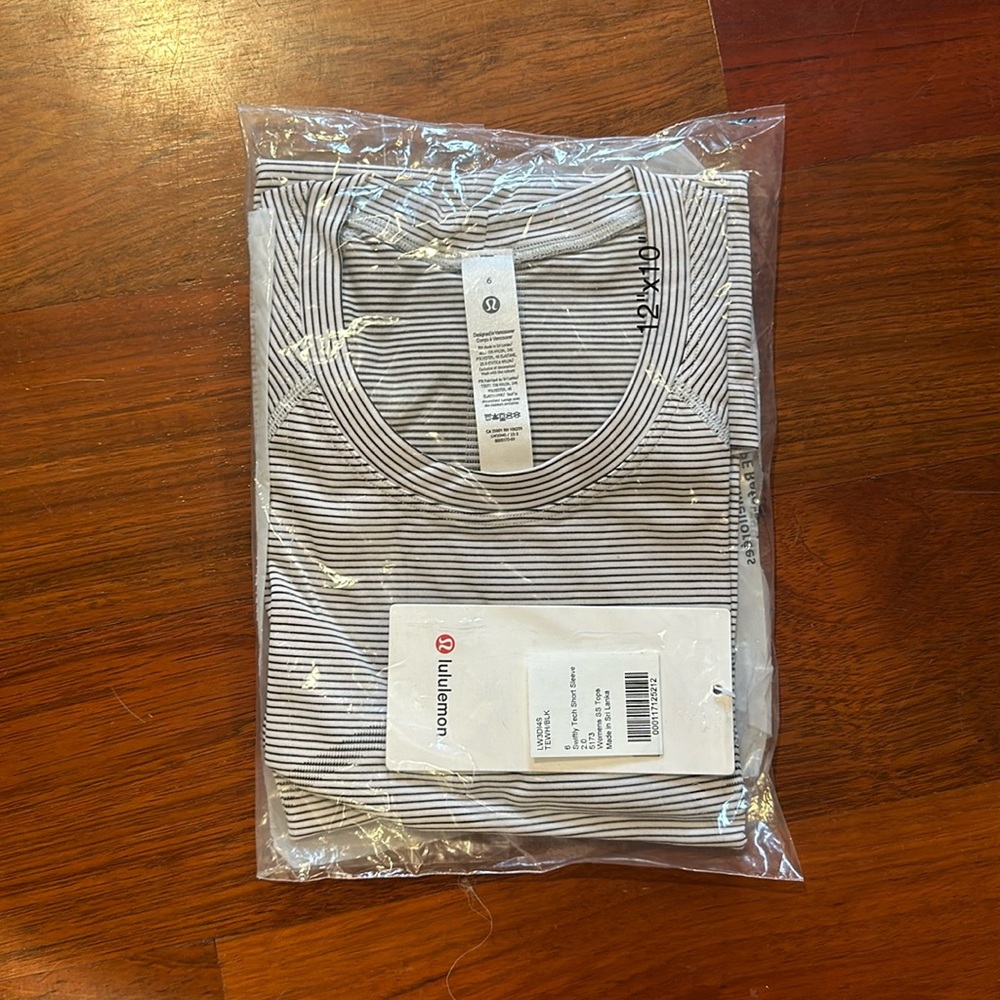 Brand new, unopened swiftly tech short sleeve shirt.
